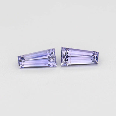 Matched pair of 0.79 ctw tapered baguette cut natural purple sapphires in four-prong settings