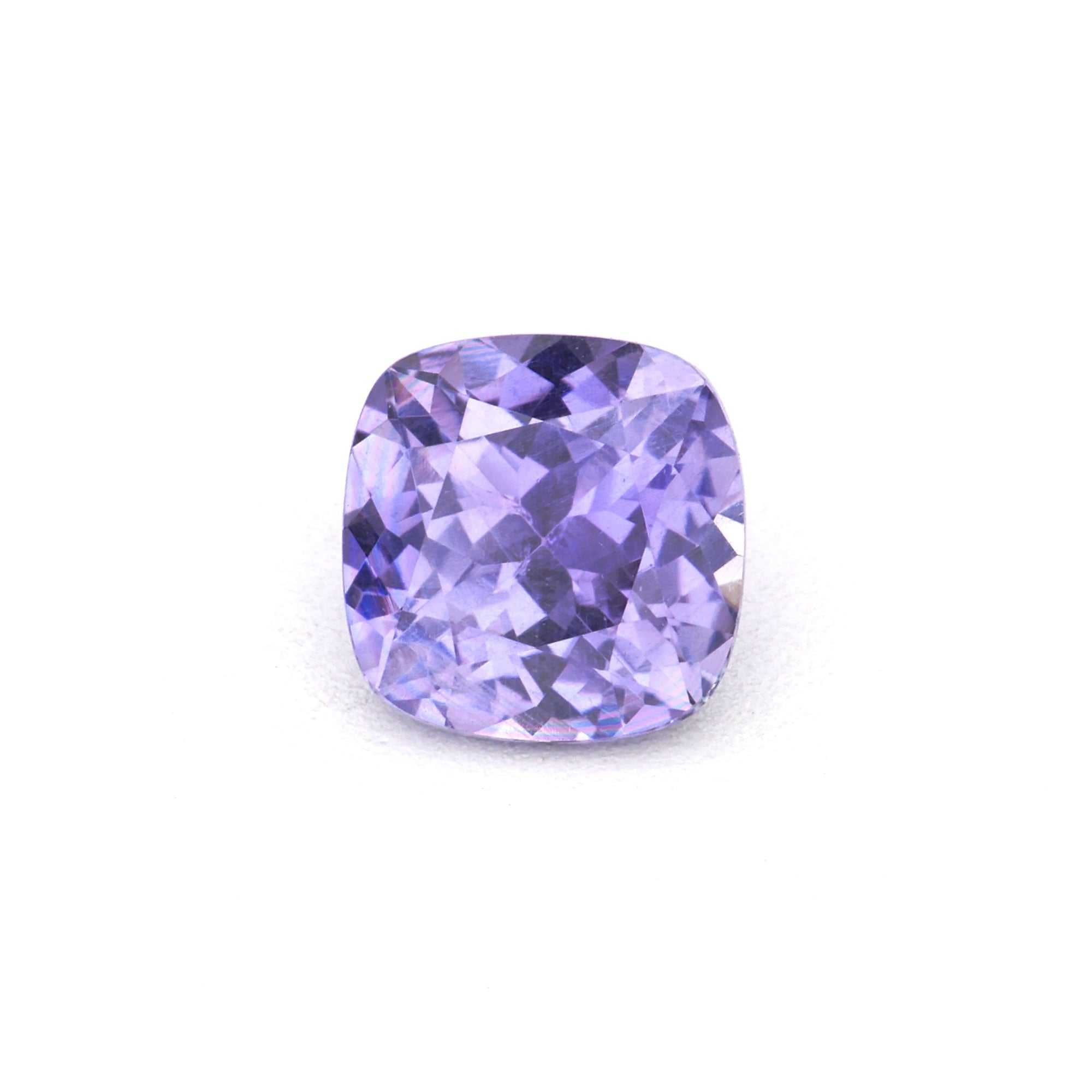 0.46 ct Violet Cushion Sapphire gemstone showcasing natural purple-blue hues and precision cut for brilliance
