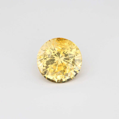 3.13 ct unheated natural yellow sapphire with round brilliant cut and radiant golden hue