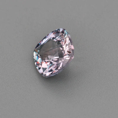 0.63 ct natural unheated violet sapphire with violetish gray color and precision cut sparkle