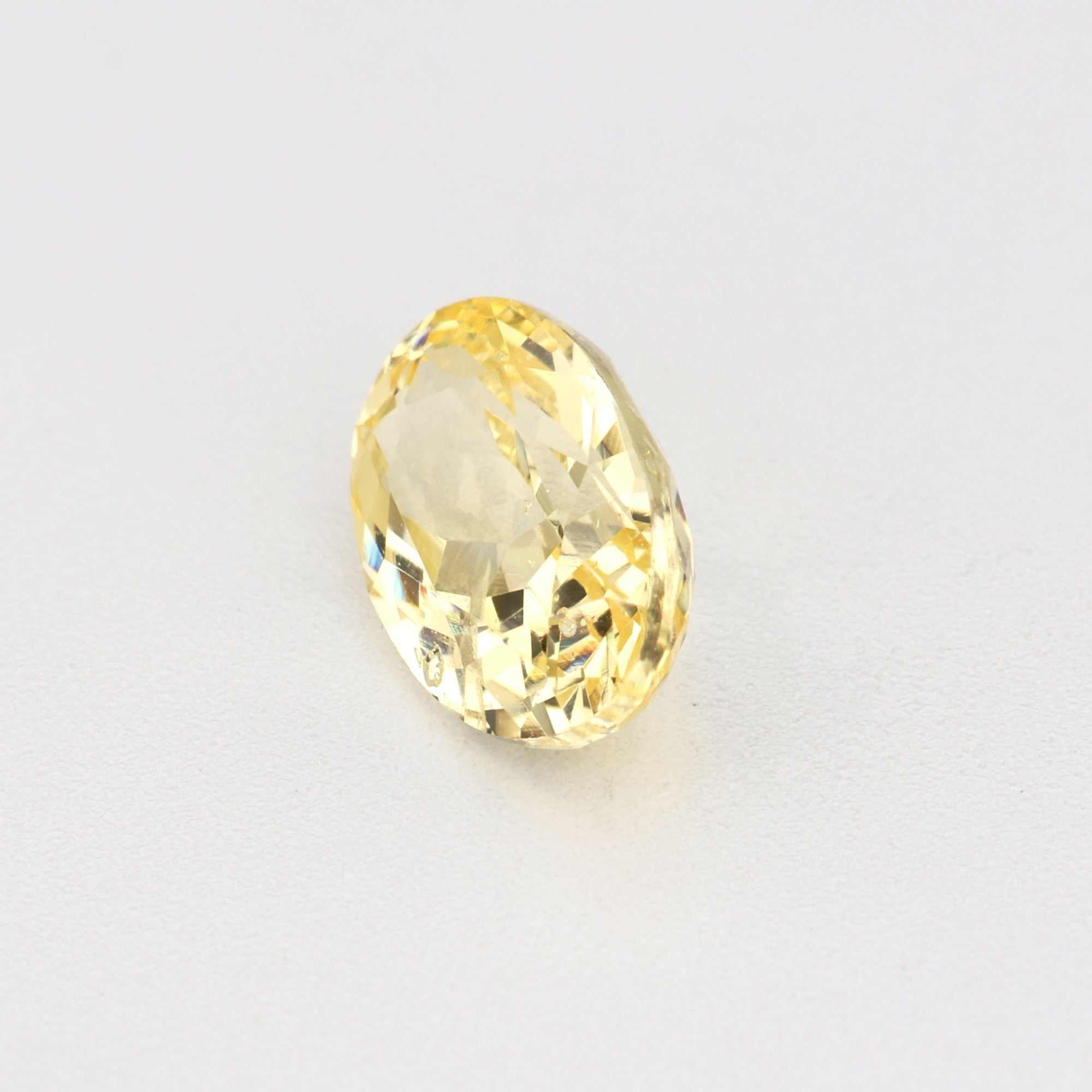 0.62ct unheated yellow sapphire gemstone with natural golden hue and excellent clarity