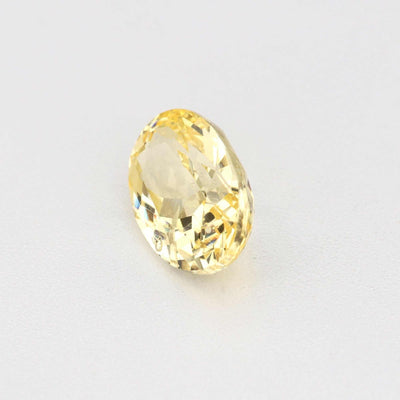 0.62ct unheated yellow sapphire gemstone with natural golden hue and excellent clarity