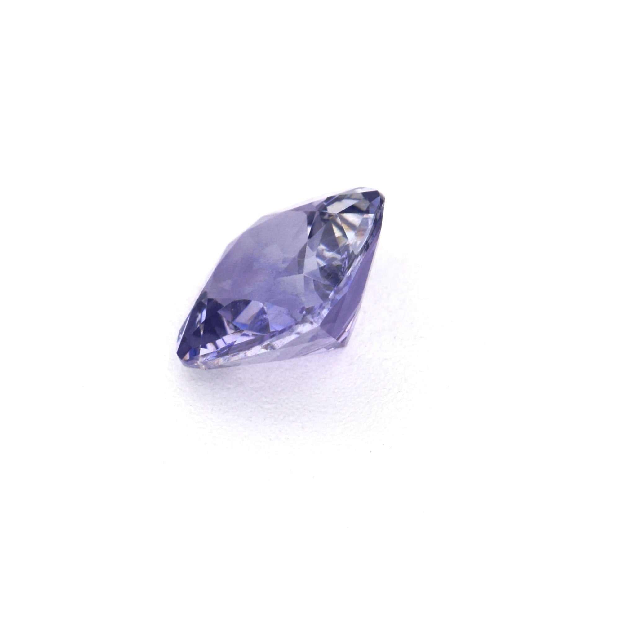 0.46 ct Violet Cushion Sapphire gemstone with vivid purple-blue hue and precision cut for jewelry designs