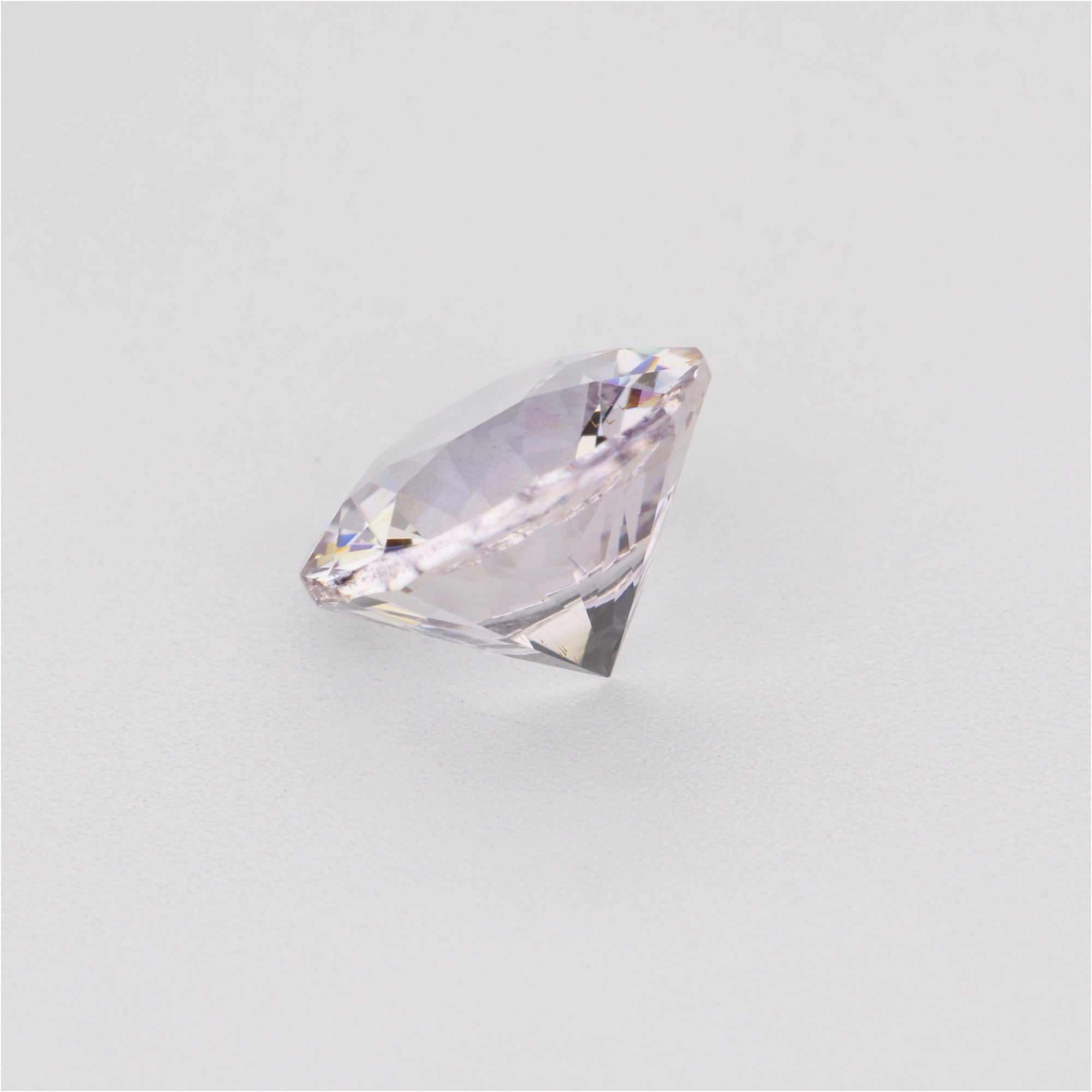 1.30 ct Round White Sapphire Gemstone on white background showing transparency
