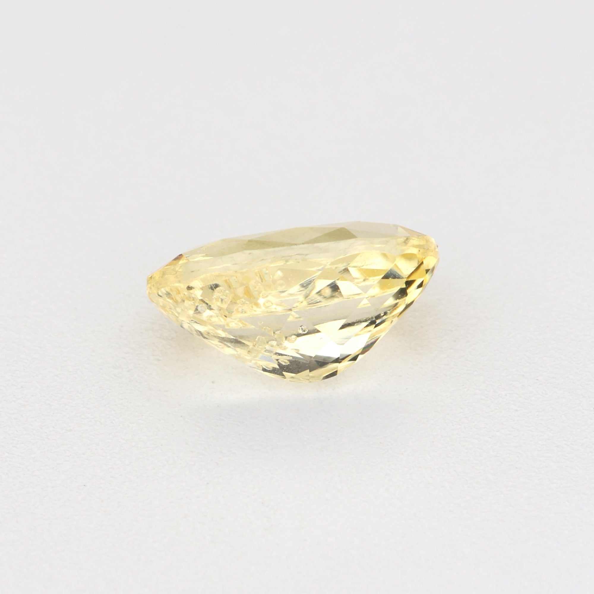 0.62ct unheated yellow sapphire gemstone with natural golden hue and high clarity