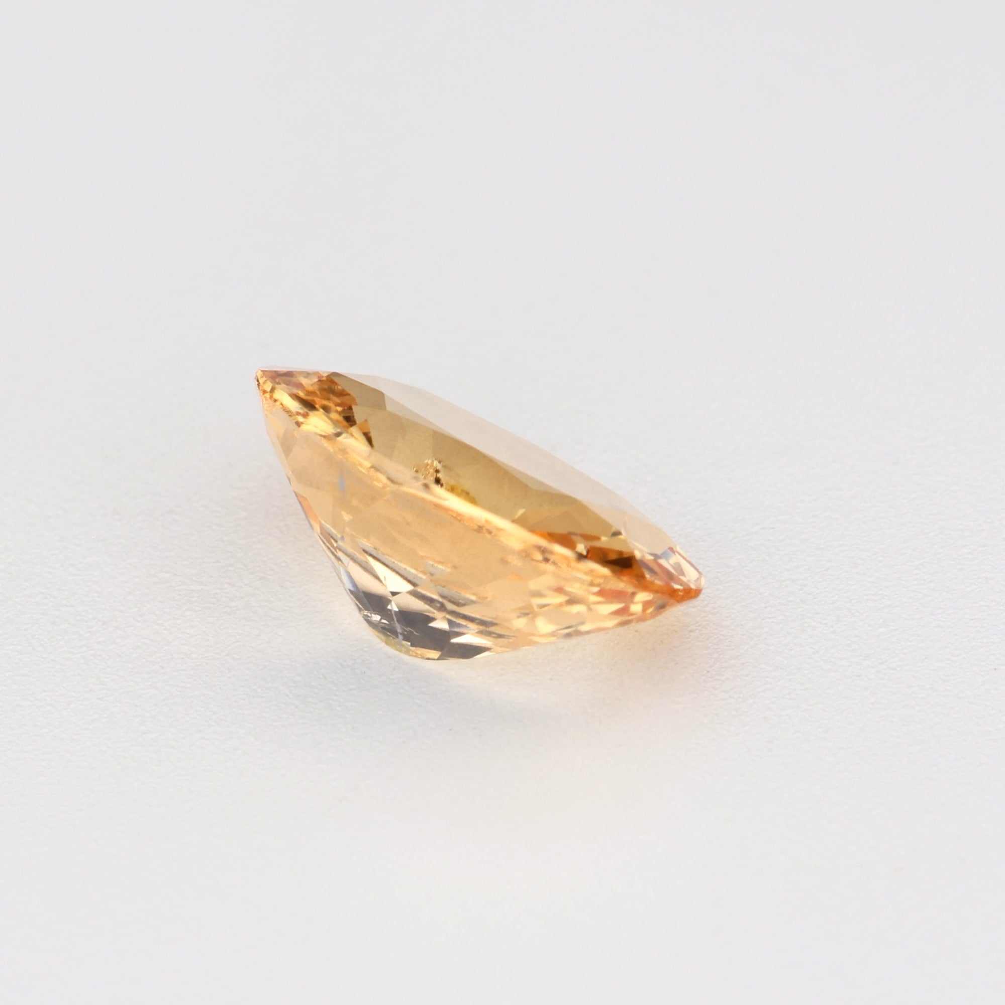 0.81 ct natural unheated peach sapphire gemstone displaying warm peachy-orange hues and excellent clarity for custom jewelry designs