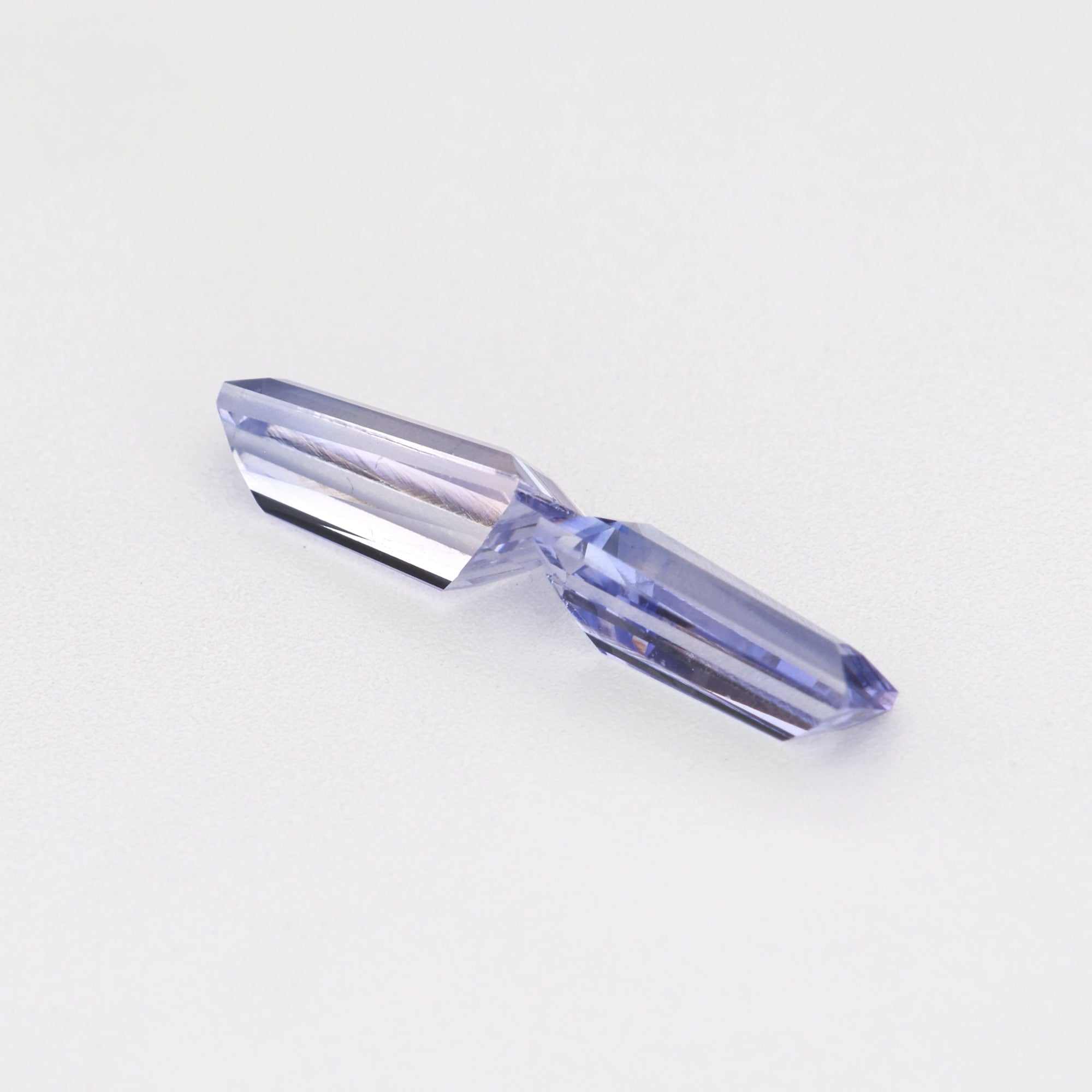 0.78 ctw tapered baguette purple sapphire pair showing matched cut and transparency