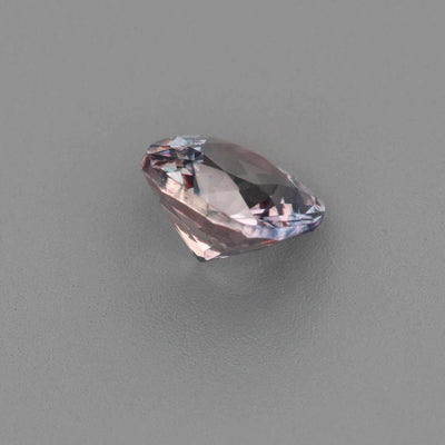 0.63 ct untreated violet sapphire with gray undertones and precision cut sparkle