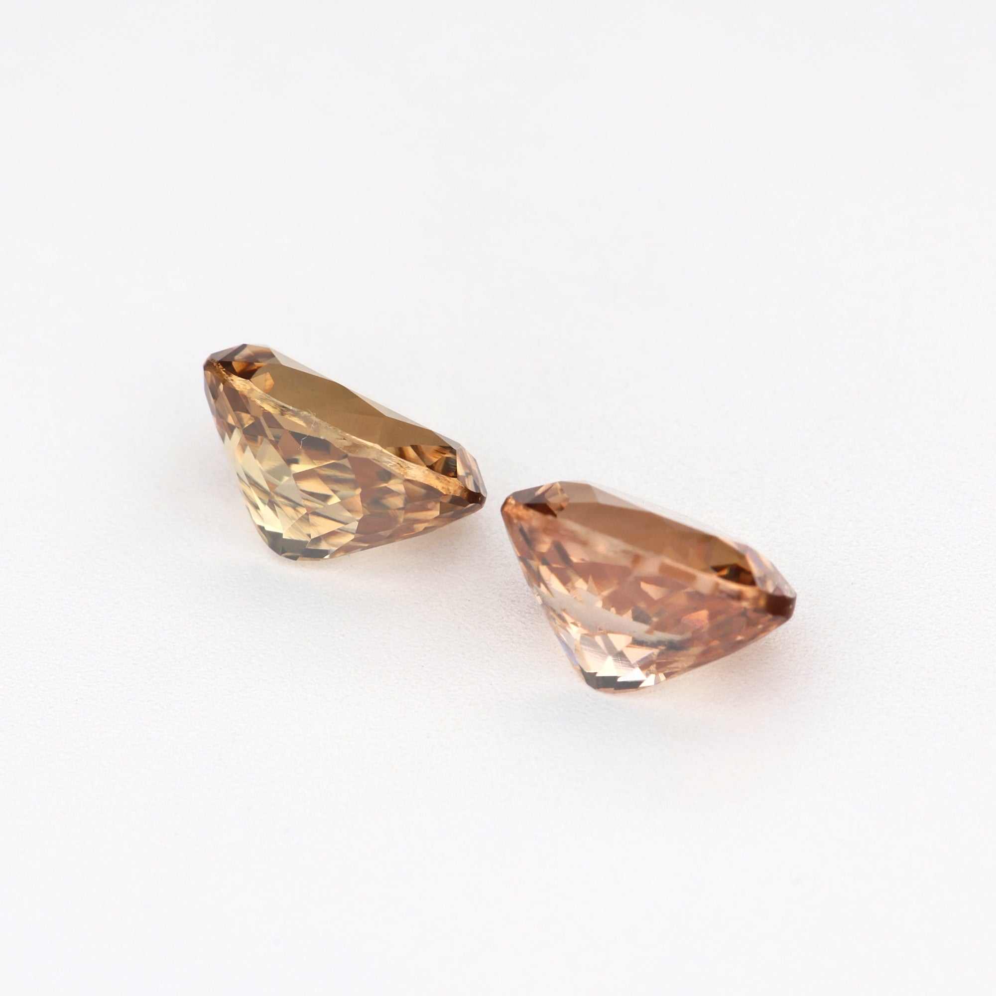 2.24 ct natural brown zircon pair displaying warm golden brown hues and brilliant clarity for custom jewelry designs