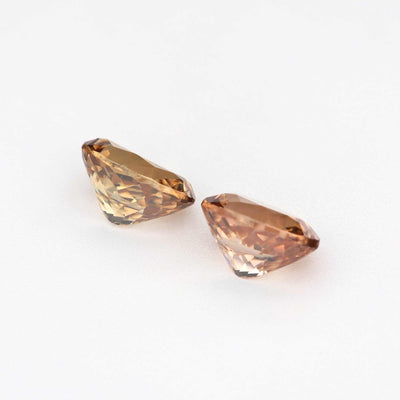 2.24 ct natural brown zircon pair displaying warm golden brown hues and brilliant clarity for custom jewelry designs