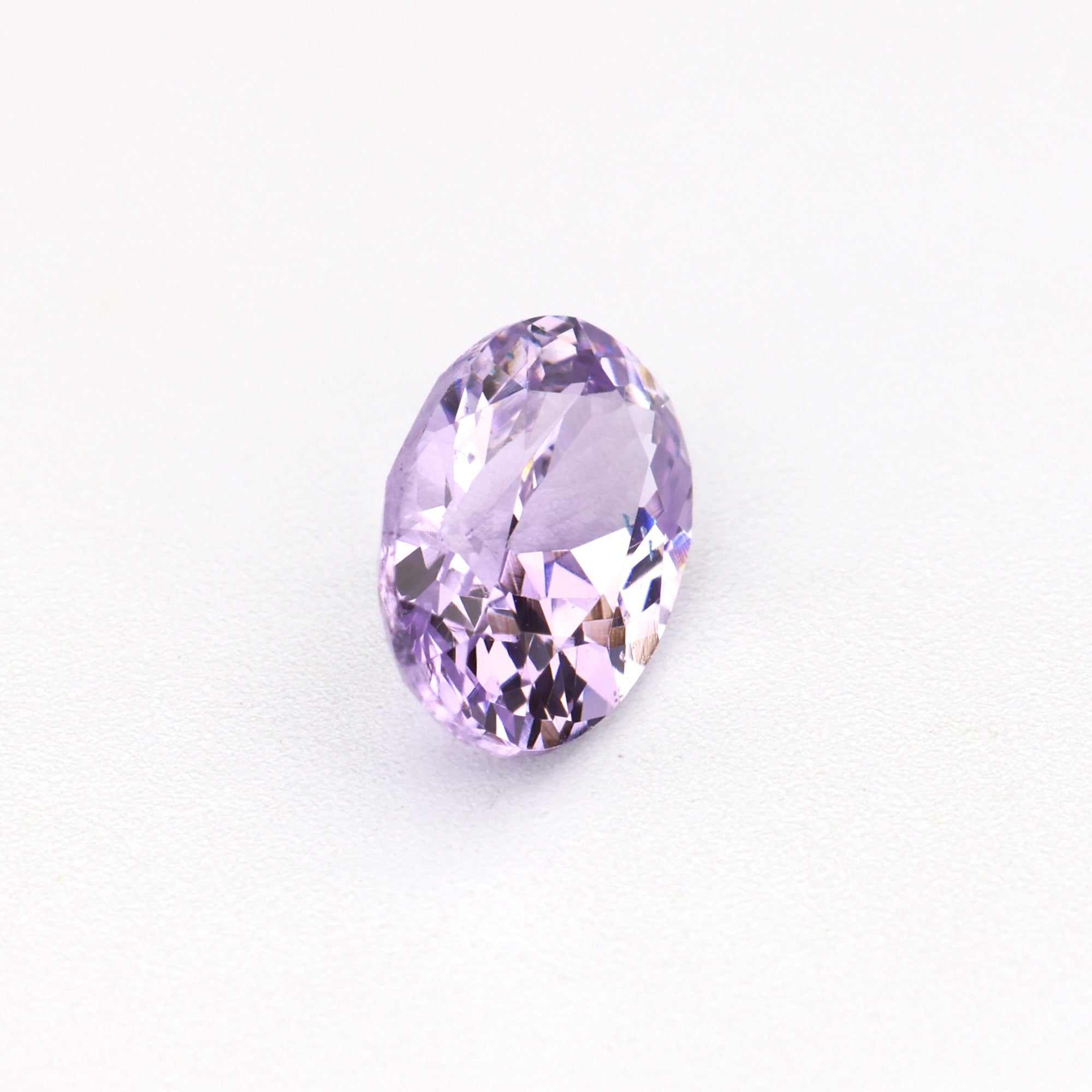 0.60 ct untreated natural lavender sapphire gemstone with vivid purple hue and excellent clarity