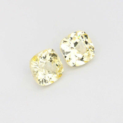 Pair of 1.11 ct unheated yellow sapphires with natural clarity and golden hue