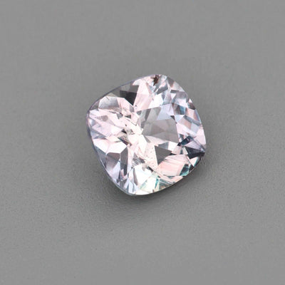 0.63 ct untreated violet sapphire gemstone with excellent clarity and unique violet-gray color