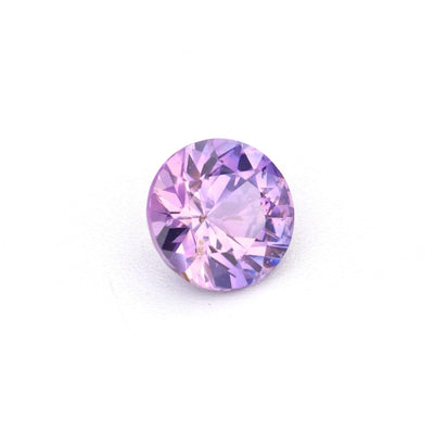 Close-up of a 0.34 carat natural unheated violet sapphire with rich purple color and excellent clarity
