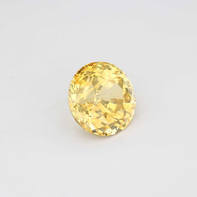 3.13 ct unheated natural yellow sapphire round brilliant cut gemstone with excellent clarity and warm golden hue