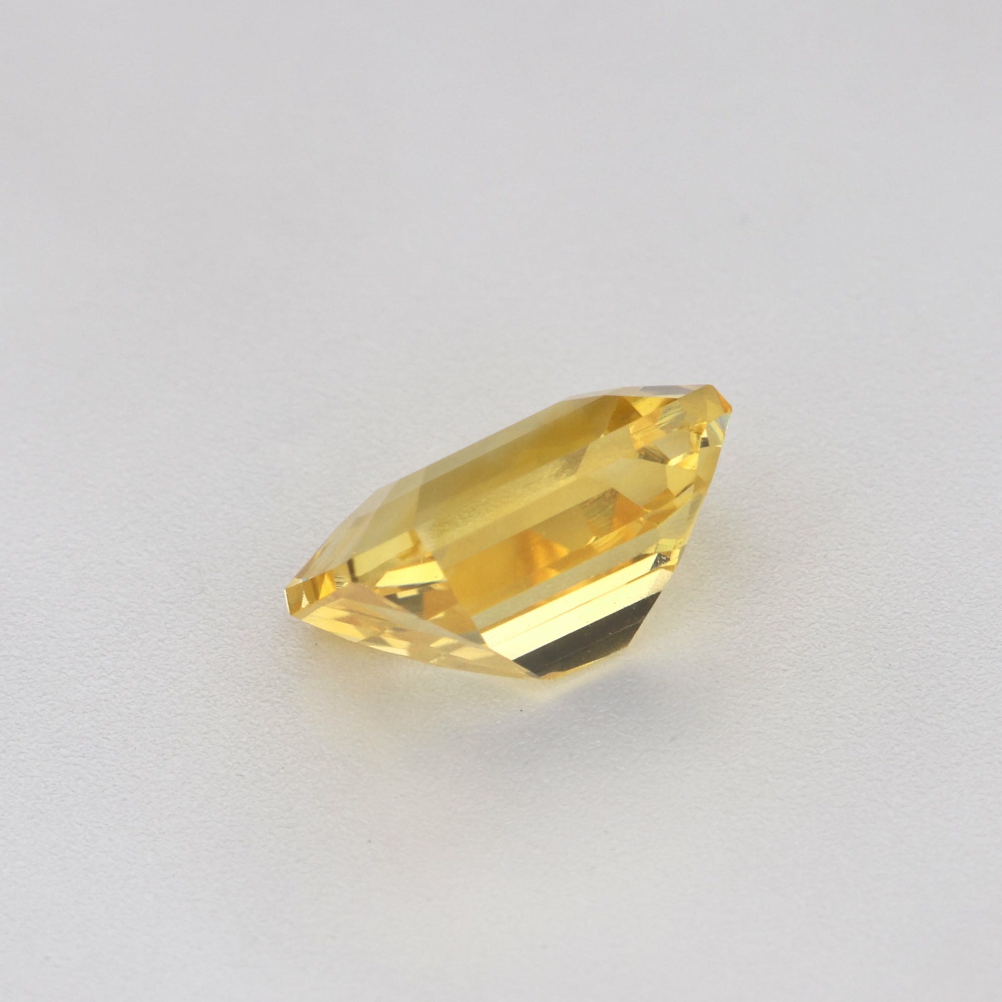 1.17 ct Emerald-Cut Ceylon Yellow Sapphire showcasing a vibrant golden hue and excellent clarity.