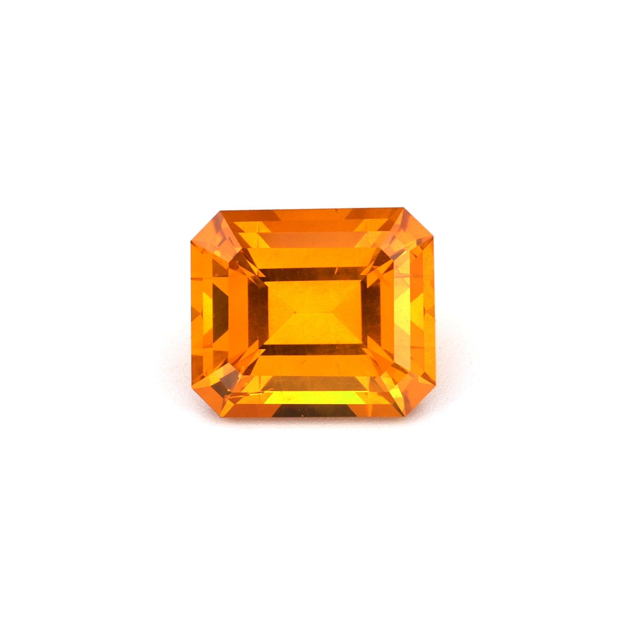 3.09 ct emerald cut natural orange sapphire with vibrant color and GIA certification