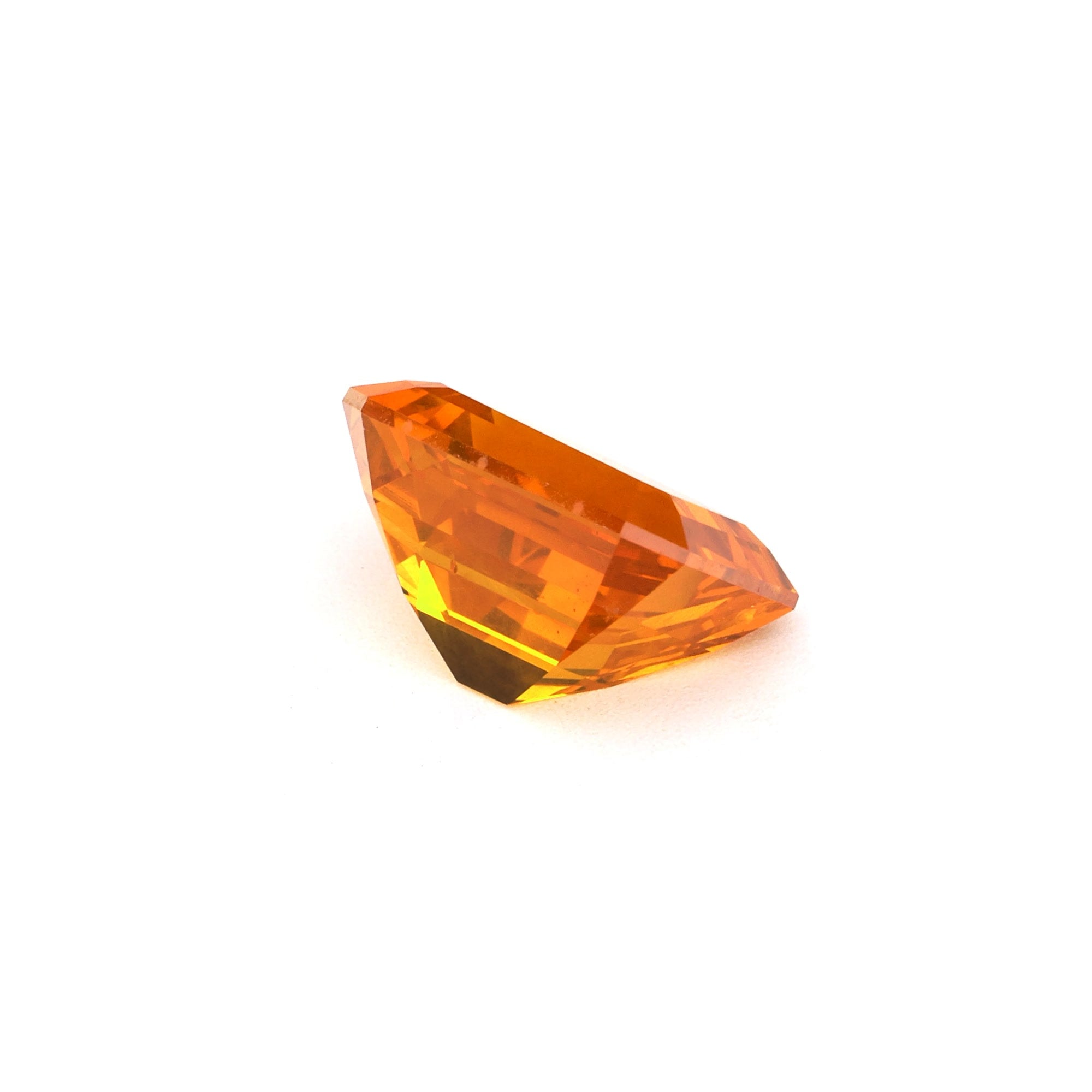 3.09 ct emerald cut orange sapphire with strong color and GIA certification