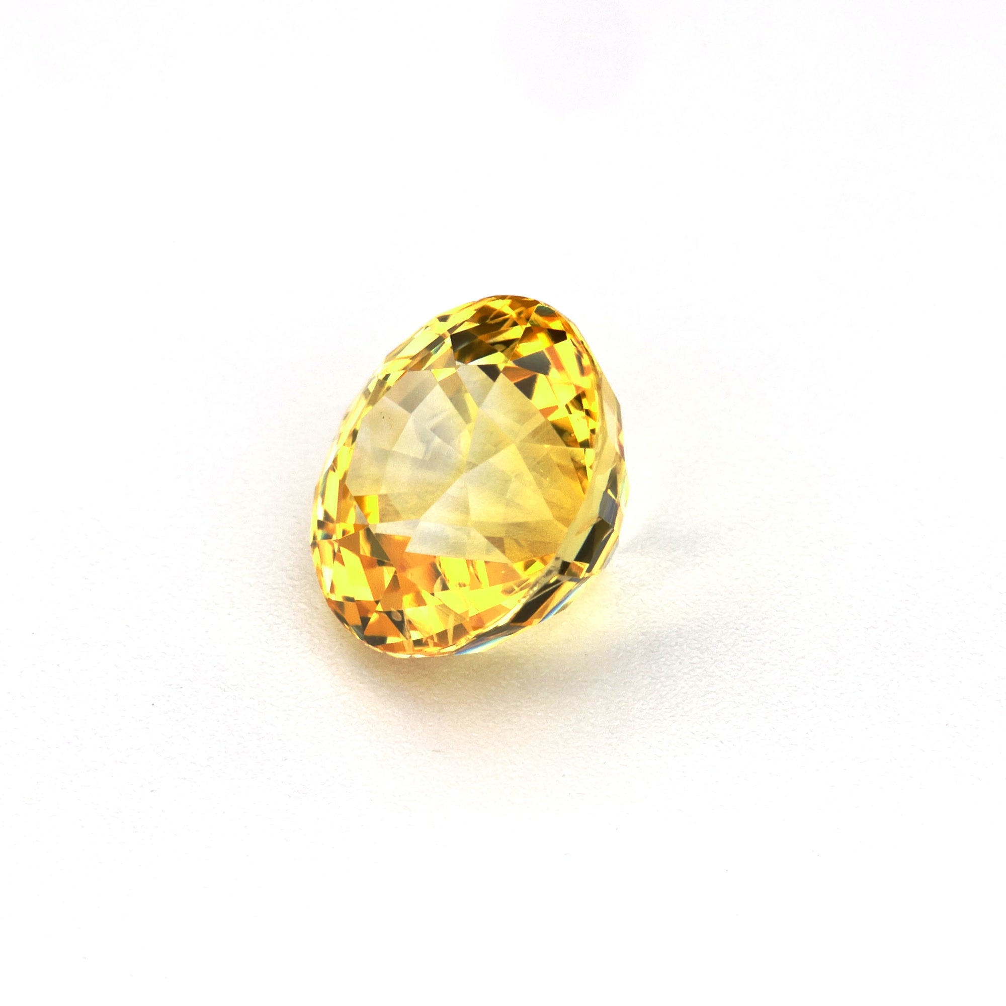 1.50 ct natural Round Yellow Sapphire showing precision-cut faceting and color saturation
