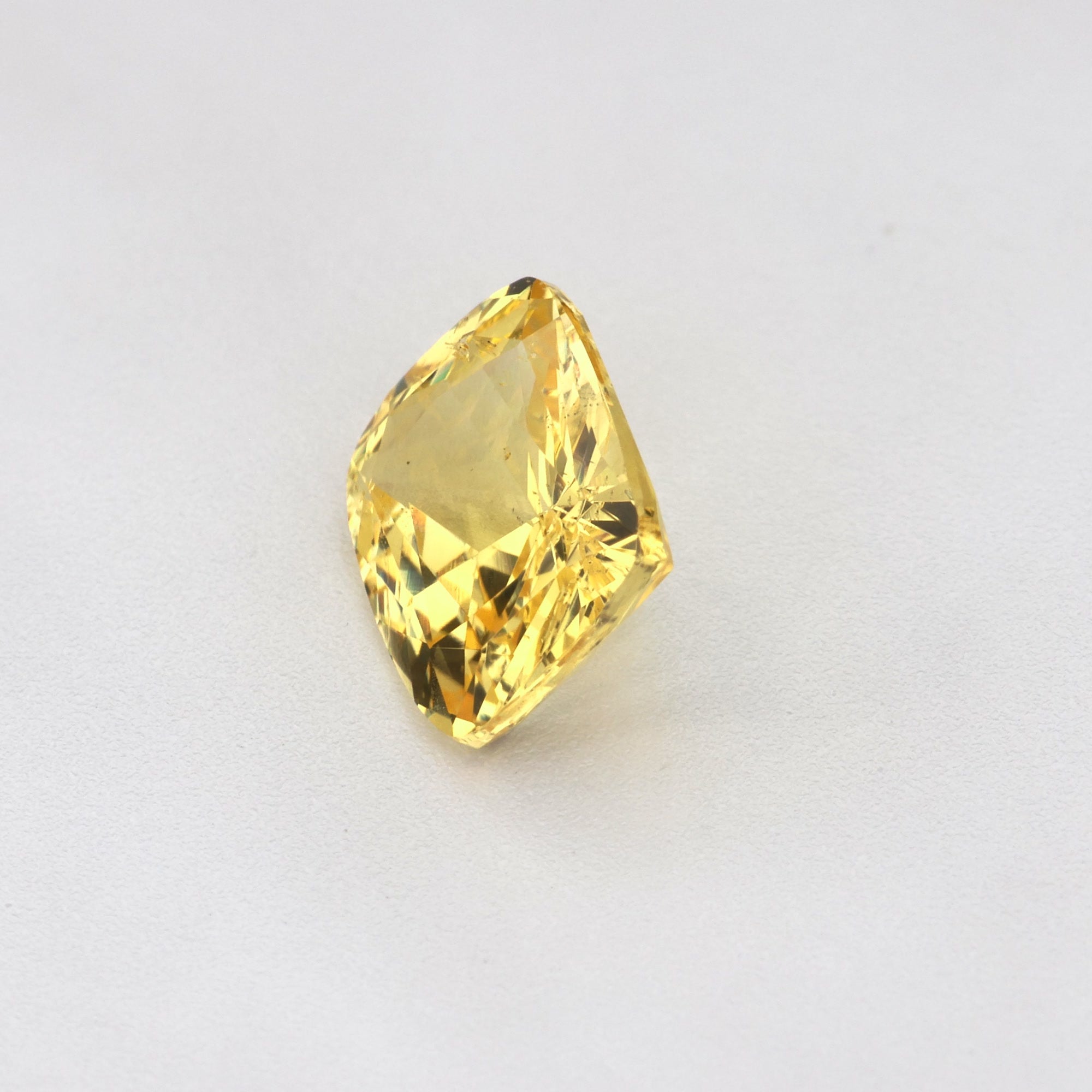 1.19 ct Cushion Cut Ceylon Yellow Sapphire showcasing a natural golden hue and exquisite cut.