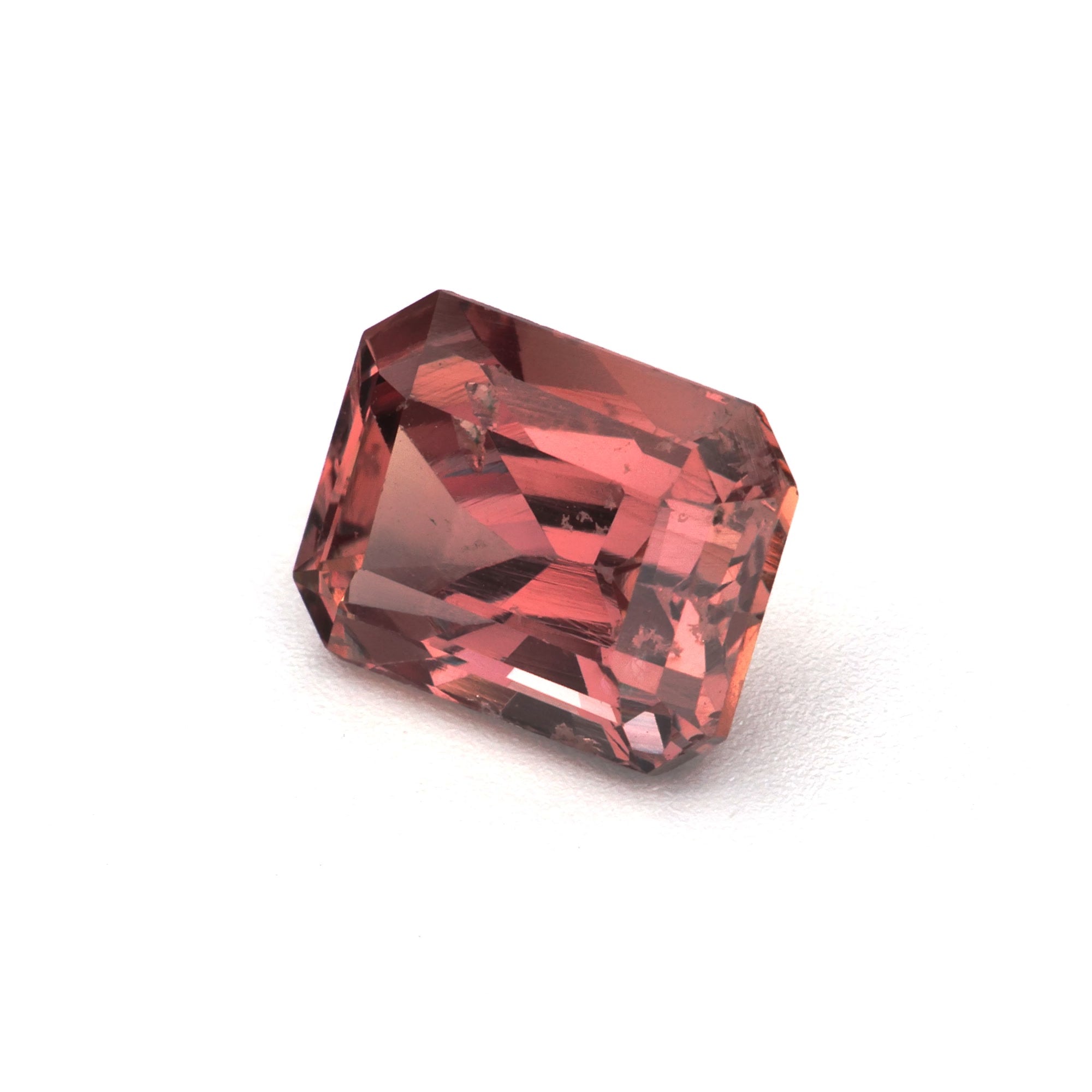 1.62 ct Emerald-Cut Brown Sapphire from Madagascar, showcasing its unique earthy color and brilliance.