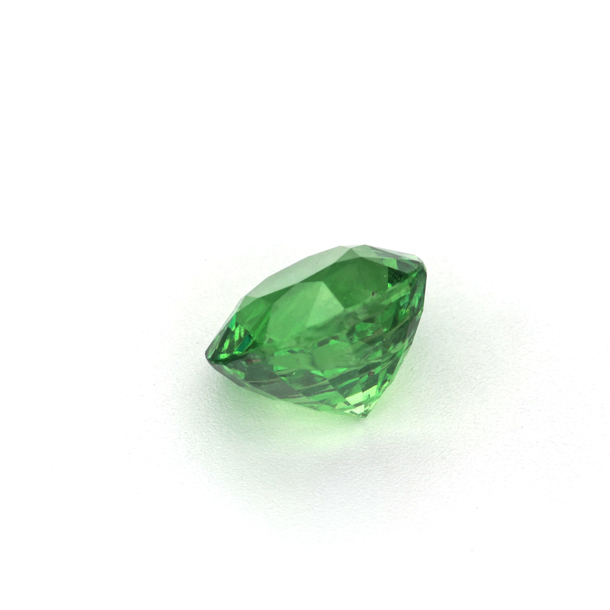 1.79 ct Round Tsavorite Garnet displaying vivid green color and brilliant cut, clarity enhanced per GIA.