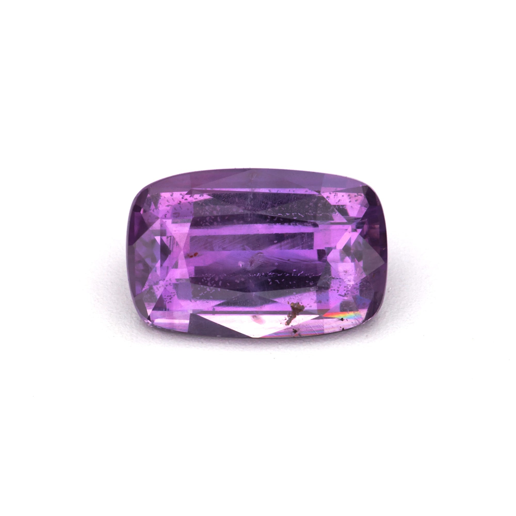1.45 ct Natural Heat-Treated Purple Sapphire showcasing a rich, velvety pinkish-purple hue.