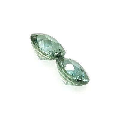 Pair of 1.50 ctw natural untreated teal sapphire gemstones with brilliant cut and rich teal color