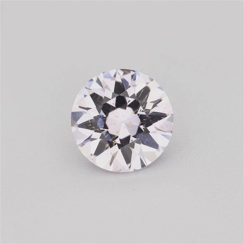 1.30 ct round white sapphire video showing diamond-like sparkle and warm tint