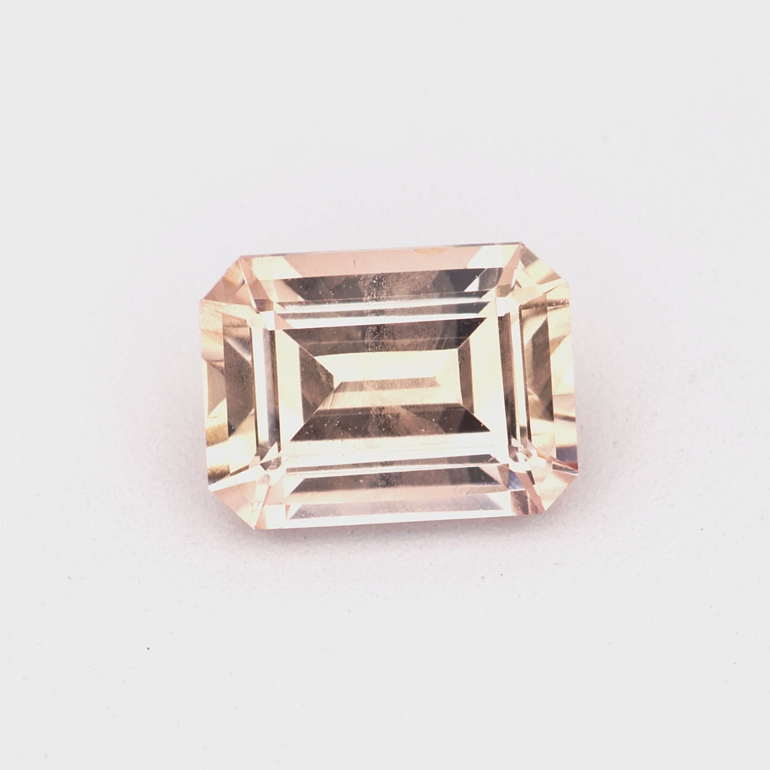 0.61 ct emerald cut unheated pink sapphire rotating to show delicate pink color and brilliance