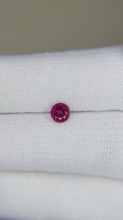 0.52 ct round natural ruby video showing fire and brilliance from multiple angles