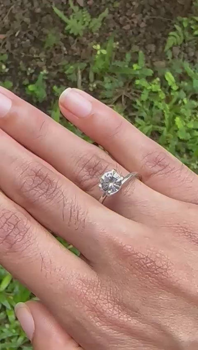 1.27 ct white sapphire video showing diamond-like sparkle under light