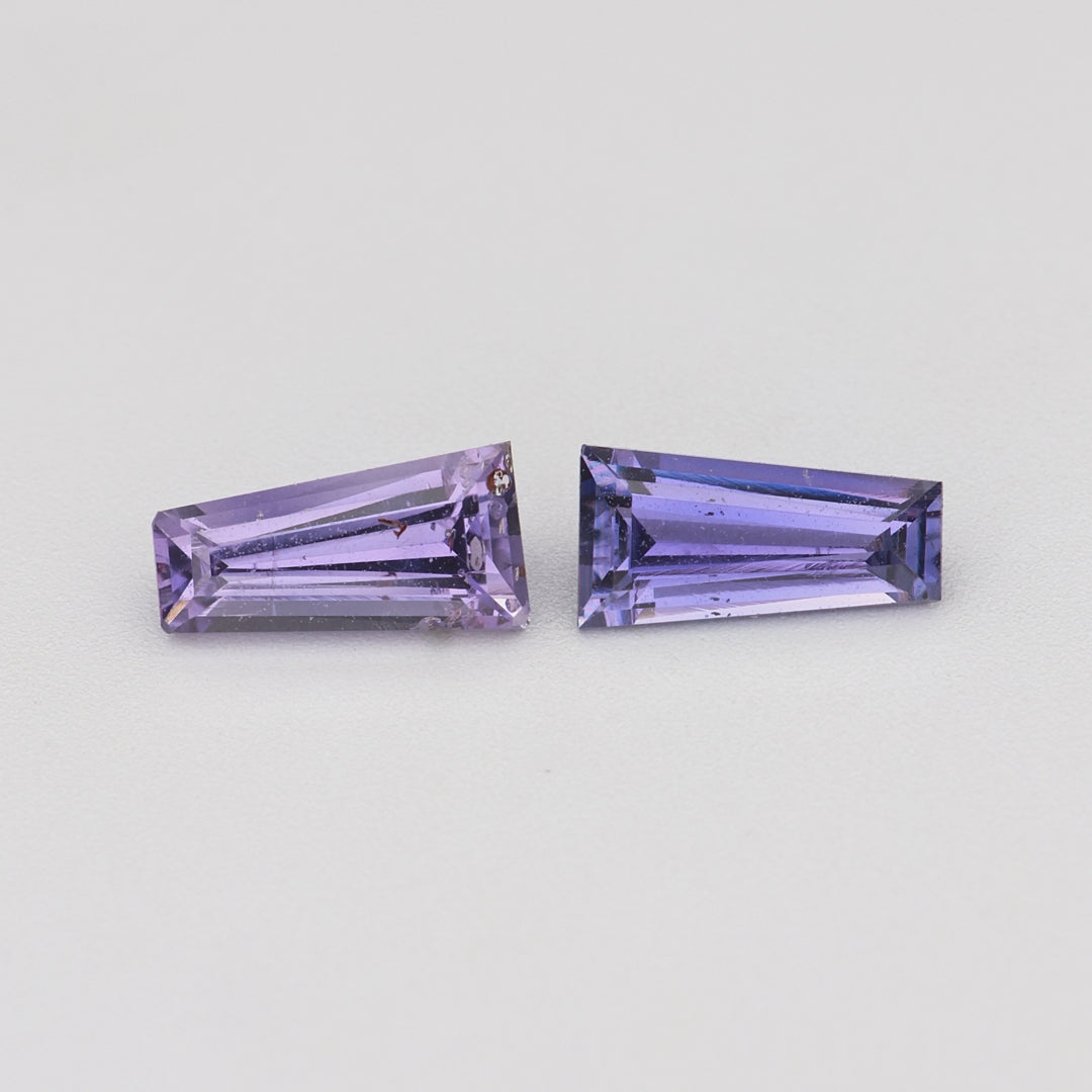 Load video: 0.69 ctw matched pair tapered baguette purple sapphires rotating to show color and brilliance