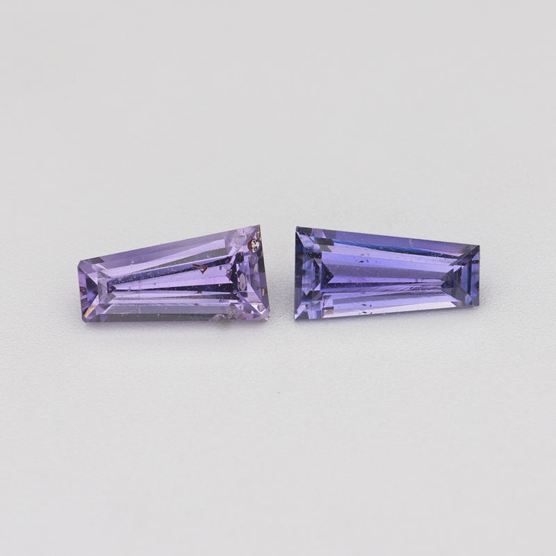 0.69 ctw matched pair tapered baguette purple sapphires rotating to show color and brilliance