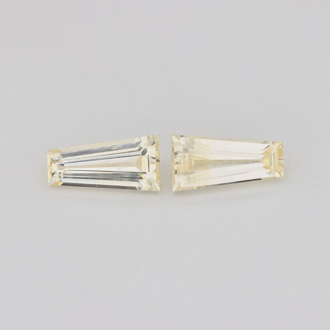 Load video: 0.74 ctw Tapered Baguette cut Yellow Sapphire ~ matched pair
