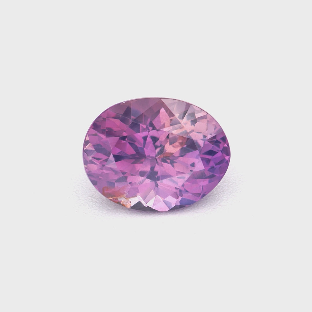 0.54 ct oval unheated purplish-pink Ceylon sapphire video showing violet-rose color and brilliance