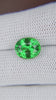 Tsavorite garnet in the hand Image