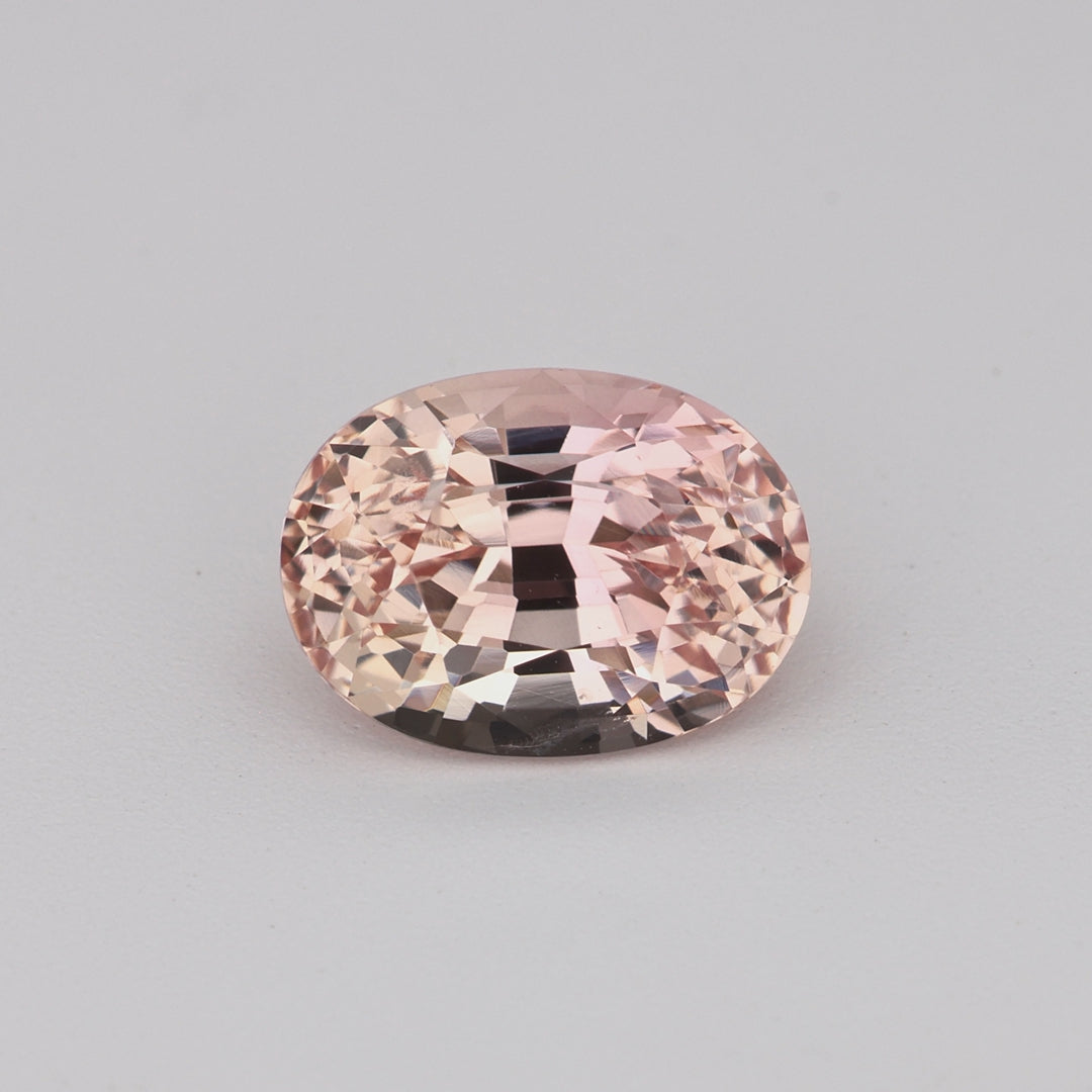 1.23 ct oval peach sapphire rotating to show warm peach color and brilliance
