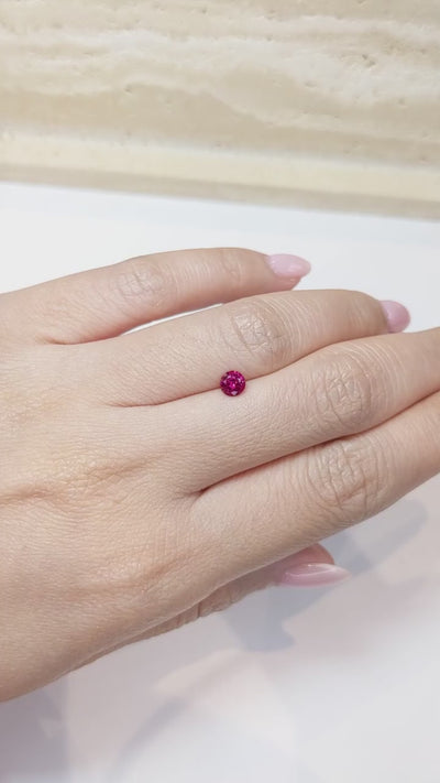 0.52 ct round natural ruby video showing 5mm round silhouette and red hue