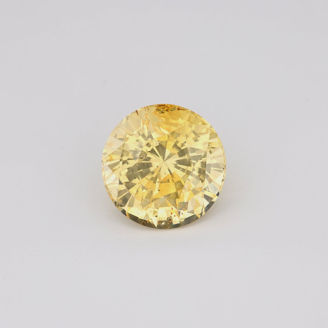 3.13 ct round Ceylon unheated yellow sapphire rotating to show golden hue and brilliance