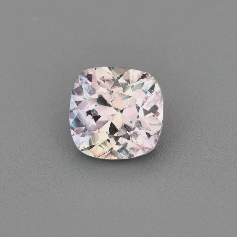 0.63 ct square cushion unheated violetish-gray sapphire rotating to show color and brilliance