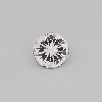 1.27 ct round unheated white sapphire from Ceylon showing brilliance and clarity
