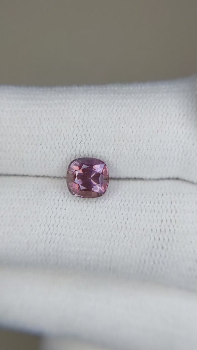 1.47 ct pinkish-brown sapphire video showing cushion cut sparkle under light