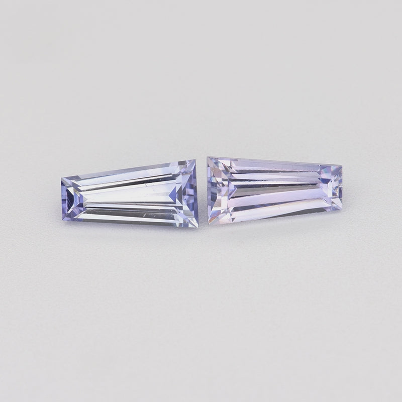 0.78 ctw matched pair tapered baguette purple sapphires rotating to show color and brilliance