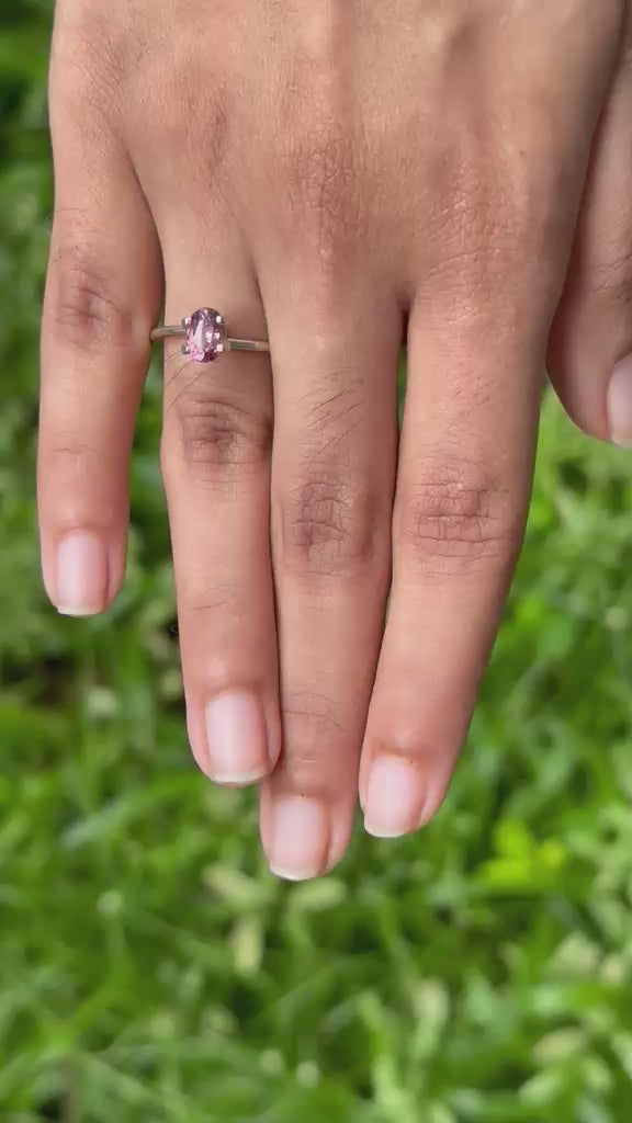 1.13 ct Vietnam purplish pink sapphire stone in hand