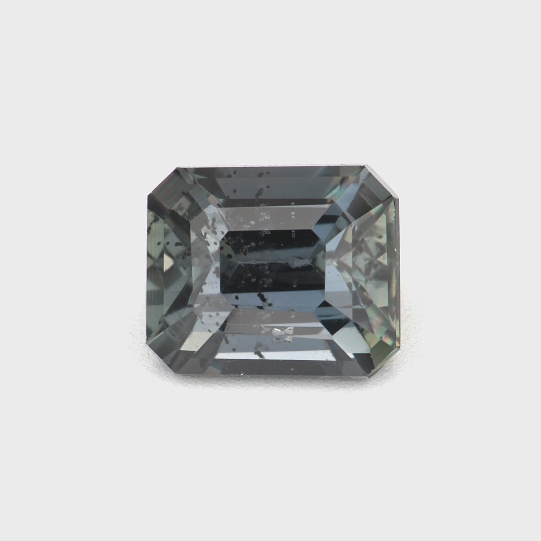 1.03 ct untreated color-change sapphire shifting between green and reddish-purple under light