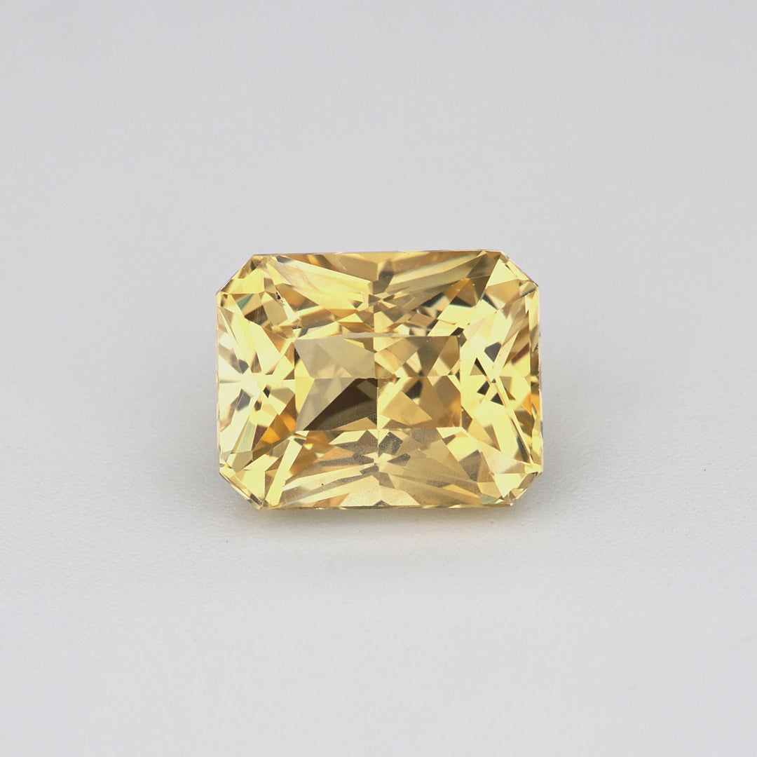 1.66 ct radiant cut unheated yellow sapphire rotating to show golden hue and brilliance